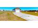 Home with a spacious driveway leading to a two-car garage on a large lot at 163 Grace Pond Ave, Benson, NC 27504