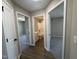 Hallway featuring views of the bathroom and bedrooms with neutral walls and modern fixtures at 163 Grace Pond Ave, Benson, NC 27504