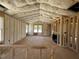 Spacious home interior with insulation, framed walls, fireplace, and large windows at 163 Grace Pond Ave, Benson, NC 27504