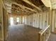 Unfinished interior framing and insulation of a new home build with lots of natural light at 163 Grace Pond Ave, Benson, NC 27504