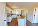 Modern kitchen featuring white cabinets, granite countertops, and stainless appliances at 163 Grace Pond Ave, Benson, NC 27504