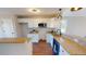 Bright kitchen featuring white cabinets, granite countertops, and stainless steel microwave at 163 Grace Pond Ave, Benson, NC 27504