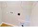 Bright laundry room featuring open shelving and appliances at 163 Grace Pond Ave, Benson, NC 27504