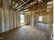 Spacious living room framing, featuring large windows and ample space, offering a glimpse of the home's future comfort and style at 163 Grace Pond Ave, Benson, NC 27504