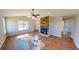 Open living room with vaulted ceiling, stone fireplace, and natural light at 163 Grace Pond Ave, Benson, NC 27504