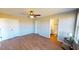 Main bedroom featuring a ceiling fan, hardwood flooring, and an ensuite bathroom at 163 Grace Pond Ave, Benson, NC 27504
