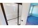 Glass enclosed shower featuring a bronze frame and a tiled shower pan at 163 Grace Pond Ave, Benson, NC 27504