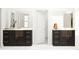 Symmetrical bathroom with double vanities, dark cabinets, and bright white marble countertops at 1717 Goldfinch Perch Ln, Knightdale, NC 27545