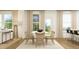 Bright dining area featuring a round table and views into a modern living space at 1717 Goldfinch Perch Ln, Knightdale, NC 27545