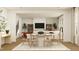 Bright dining area featuring a round table and views into a modern living space at 1717 Goldfinch Perch Ln, Knightdale, NC 27545