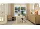 Bright home office with a modern desk, comfortable seating, and plenty of natural light at 1717 Goldfinch Perch Ln, Knightdale, NC 27545