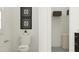 Toilet situated next to a closet for practical storage and privacy at 1717 Goldfinch Perch Ln, Knightdale, NC 27545