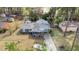 Aerial view of the home showcasing its curb appeal, driveway, and landscaping at 1800 Tee Dee St, Raleigh, NC 27610