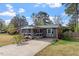 This single-story brick home features a covered porch and a long driveway at 1800 Tee Dee St, Raleigh, NC 27610