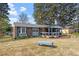 A cozy single-story brick home with a covered front porch, shutters and a well-manicured front lawn at 1800 Tee Dee St, Raleigh, NC 27610