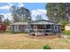 Charming single-story brick home with a cozy front porch and well-maintained landscaping at 1800 Tee Dee St, Raleigh, NC 27610