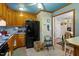 Kitchen featuring wooden cabinets, modern appliances, and tiled floor at 1800 Tee Dee St, Raleigh, NC 27610