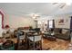 Spacious living room features hardwood floors and a ceiling fan at 1800 Tee Dee St, Raleigh, NC 27610