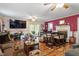 Inviting living room with a fireplace, ceiling fan, and sliding glass doors at 1800 Tee Dee St, Raleigh, NC 27610