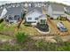 Aerial view of a fenced backyard with patio and manicured garden at 1905 Cedar Dam Ln, Wendell, NC 27591