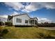 View of home's side and backyard featuring garden and patio area at 1905 Cedar Dam Ln, Wendell, NC 27591