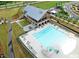 Aerial view of community pool, lounge area, and clubhouse at 1905 Cedar Dam Ln, Wendell, NC 27591