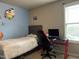 Cozy bedroom with a desk, a bright window, and a stylish chair at 194 Cornfield Ln, Benson, NC 27504
