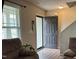 Welcoming entryway with an open door and hardwood floors at 194 Cornfield Ln, Benson, NC 27504