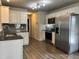 Modern kitchen with stainless steel appliances and granite countertops at 194 Cornfield Ln, Benson, NC 27504