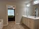 A luxurious bathroom features a double sink vanity and a view to the main bedroom at 194 Cornfield Ln, Benson, NC 27504