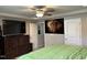Bright main bedroom with a ceiling fan, tv, and walk in closet for optimal space at 194 Cornfield Ln, Benson, NC 27504