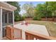 This property features a concrete patio with red Adirondack chairs surrounding a fire pit and fenced-in yard at 2001 Lilly Brook St, Fuquay Varina, NC 27526