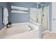 Relaxing bathroom features a large soaking tub, glass shower, and serene decor at 2001 Lilly Brook St, Fuquay Varina, NC 27526