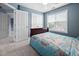 Comfortable bedroom with a full-sized bed, closet, and a bright window at 2001 Lilly Brook St, Fuquay Varina, NC 27526