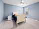 Cozy bedroom with a unique oval window and neutral carpet at 2001 Lilly Brook St, Fuquay Varina, NC 27526