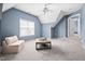 Large bonus room features vaulted ceilings, plush carpet, and plenty of natural light at 2001 Lilly Brook St, Fuquay Varina, NC 27526