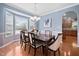 Formal dining room with bay window and elegant chandelier at 2001 Lilly Brook St, Fuquay Varina, NC 27526