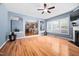Living room with hardwood floors, fireplace, and views into the kitchen at 2001 Lilly Brook St, Fuquay Varina, NC 27526