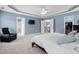 Bright main bedroom with tray ceilings, walk-in closet, and sitting area at 2001 Lilly Brook St, Fuquay Varina, NC 27526