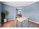 View of the office and the dining room beyond, showcasing the open floor plan and natural light at 2001 Lilly Brook St, Fuquay Varina, NC 27526