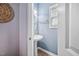 Powder room with pedestal sink and decorative accents at 2001 Lilly Brook St, Fuquay Varina, NC 27526