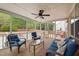 Relaxing screened porch with comfortable seating and backyard views at 2001 Lilly Brook St, Fuquay Varina, NC 27526