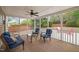 View from a screened in porch with outdoor seating and a ceiling fan at 2001 Lilly Brook St, Fuquay Varina, NC 27526