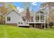 Beautiful backyard featuring a deck, patio and a glass enclosed sunroom perfect for outdoor entertaining at 2321 Mica Mine Ln, Wake Forest, NC 27587