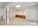 Finished basement featuring built-in desks, ample lighting, and storage solutions at 2321 Mica Mine Ln, Wake Forest, NC 27587