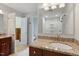 Well lit bathroom featuring a granite countertop, and a glass enclosed shower at 2321 Mica Mine Ln, Wake Forest, NC 27587