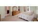 Bright bedroom featuring carpet flooring and a decorative quilt on the bed at 2321 Mica Mine Ln, Wake Forest, NC 27587