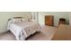 Cozy bedroom with carpet flooring, a window, and a light colored quilt on the bed at 2321 Mica Mine Ln, Wake Forest, NC 27587