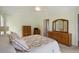 Bright bedroom featuring carpet flooring, a window, and a decorative quilt on the bed at 2321 Mica Mine Ln, Wake Forest, NC 27587