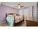 Comfortable bedroom featuring a ceiling fan, carpeted floor, and stylish accents at 2321 Mica Mine Ln, Wake Forest, NC 27587